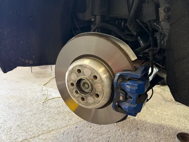 Brake pad and rotor service in progress at Reliable Motorsports