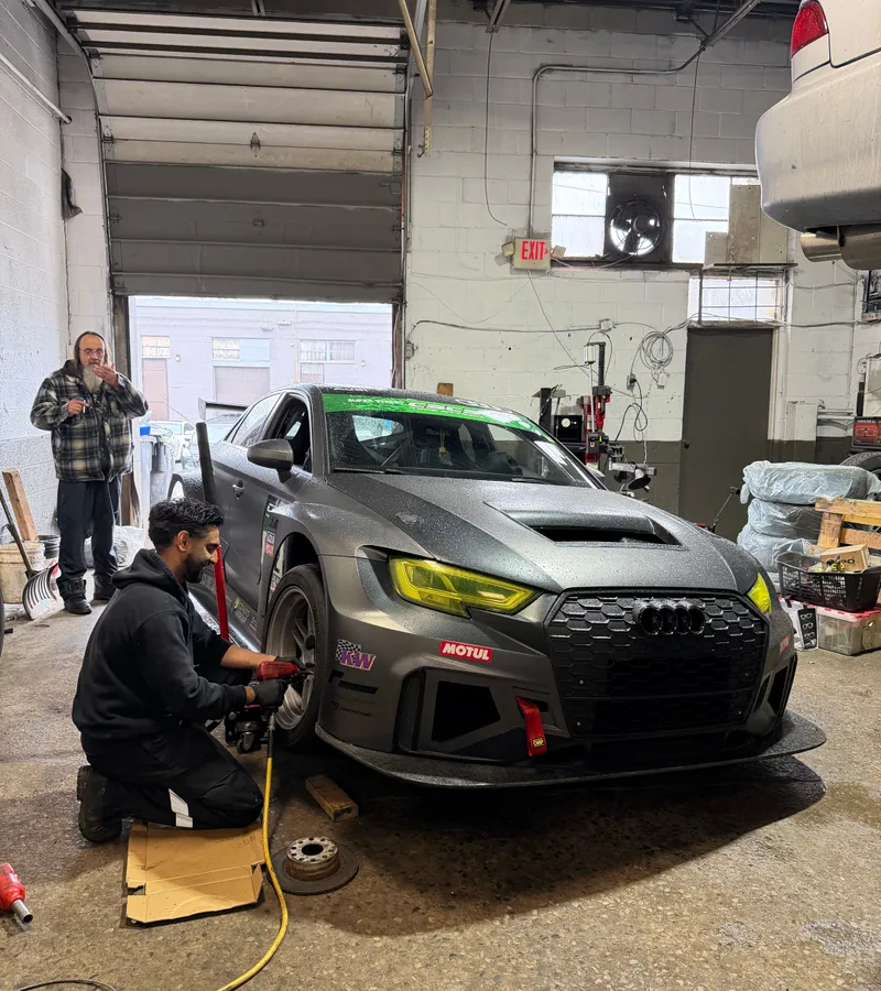 Wheel service on a track-prepped car at Reliable Motorsports